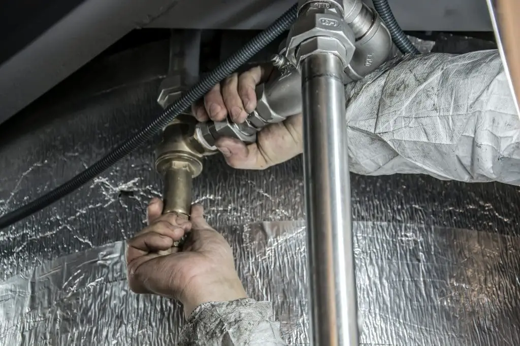 Plumber fixing a pipe