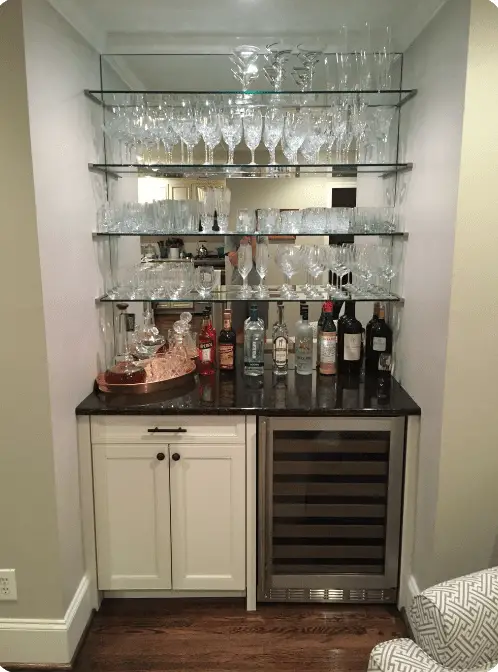 dry bar with floating glass shelves