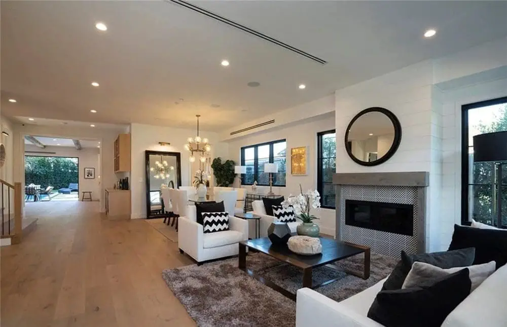 Spacious living room with white furniture