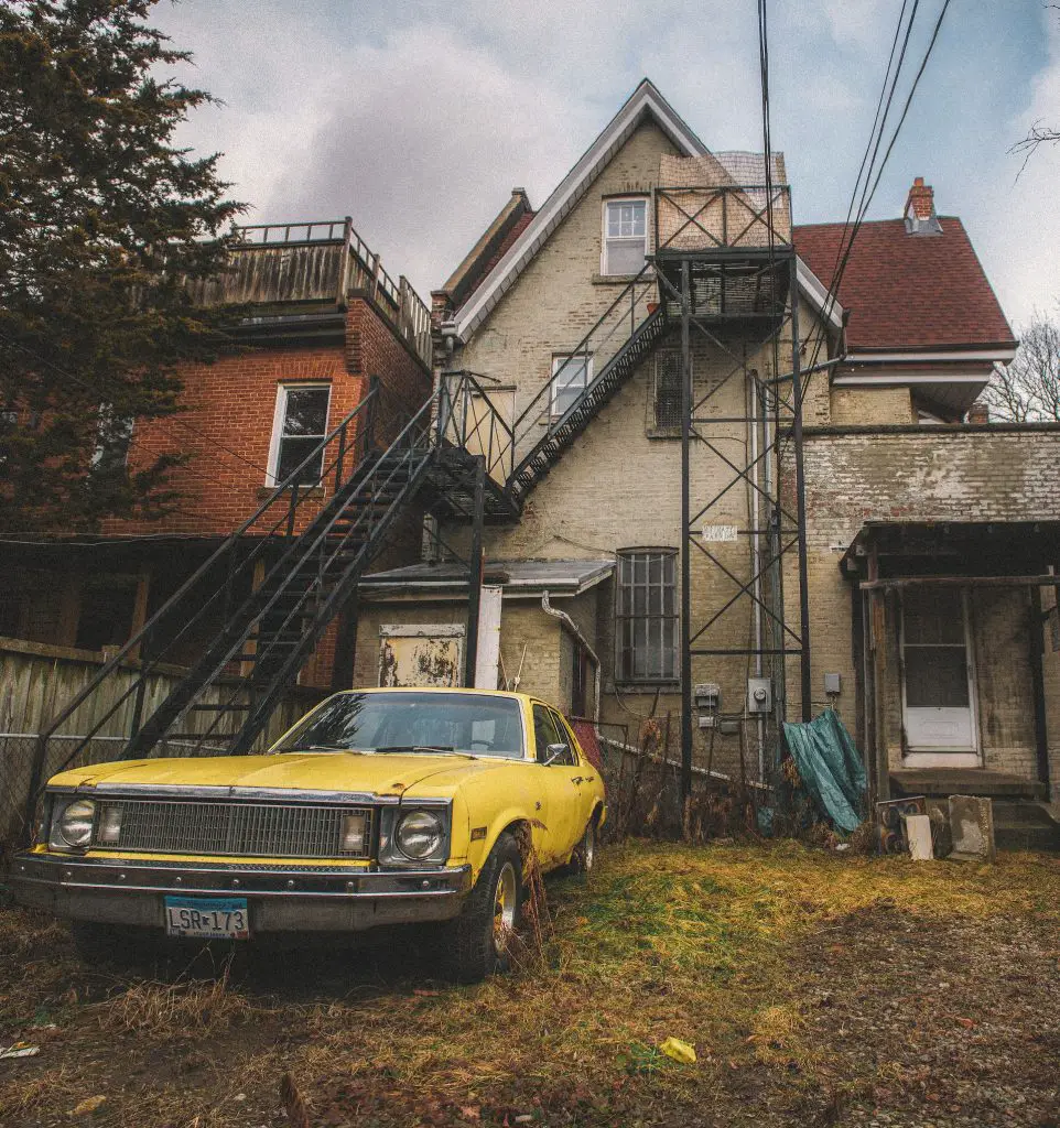 Abandoned House With A Car