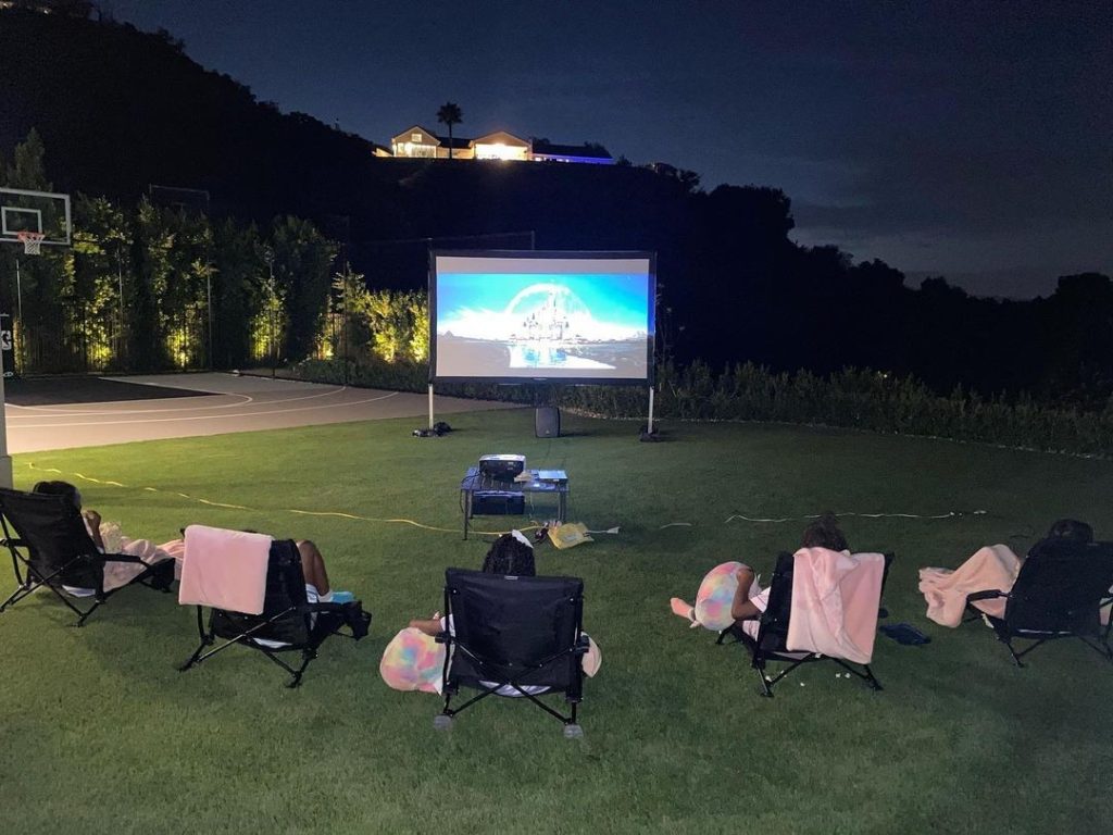 Chris Paul's Family Watching A Movie Outside The House