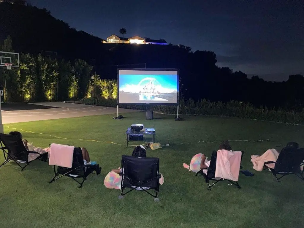 Chris Paul's Family Watching A Movie Outside The House