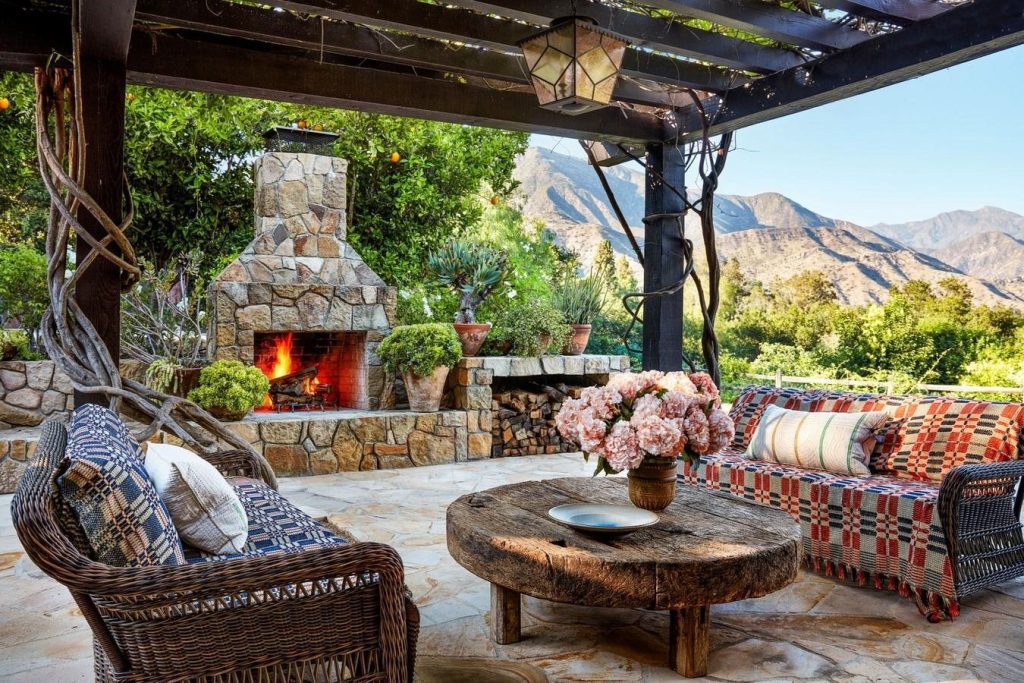 Patio With Furniture And A Fireplace