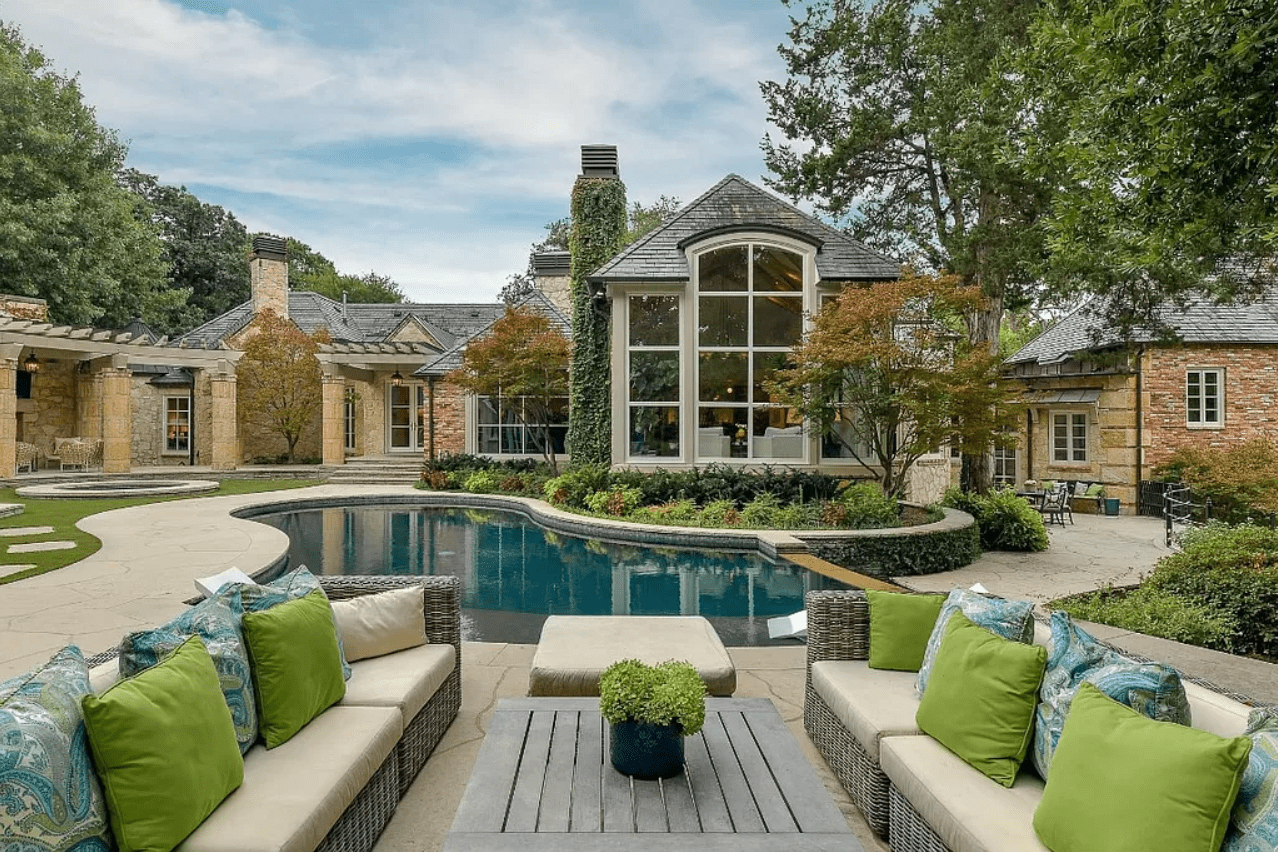 Large house with a pool and garden